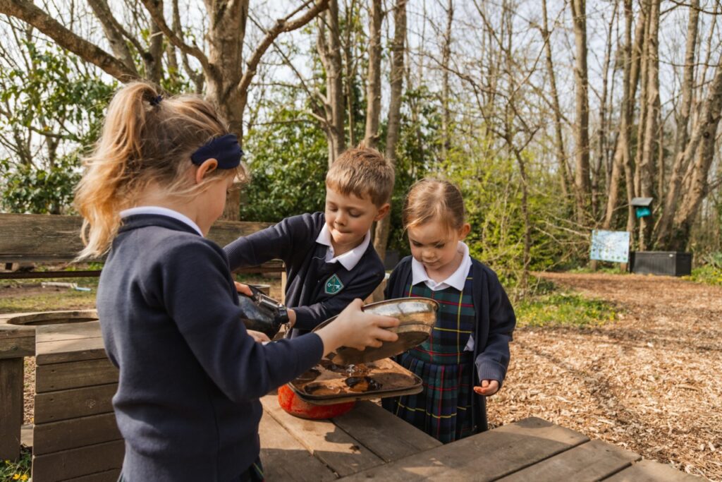 Pupils at St Peter’s Prep playing in a forest