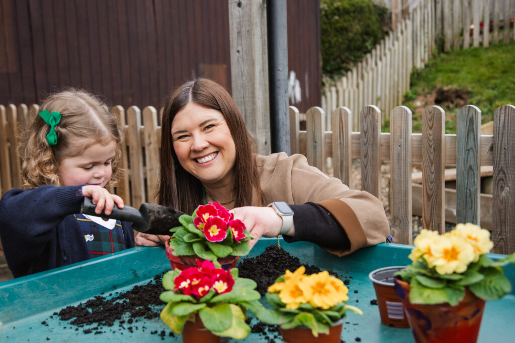 Pupil at St Peter’s Prep planting plants during outdoor learning