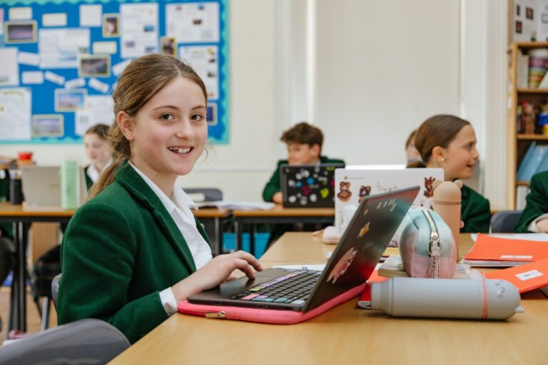 A pupil at St Peter’s Prep on a laptop in a small classroom