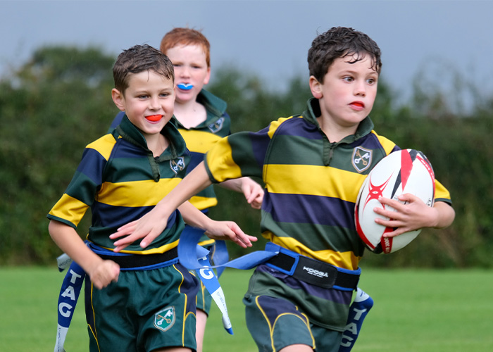 Action shot of some students playing rugby