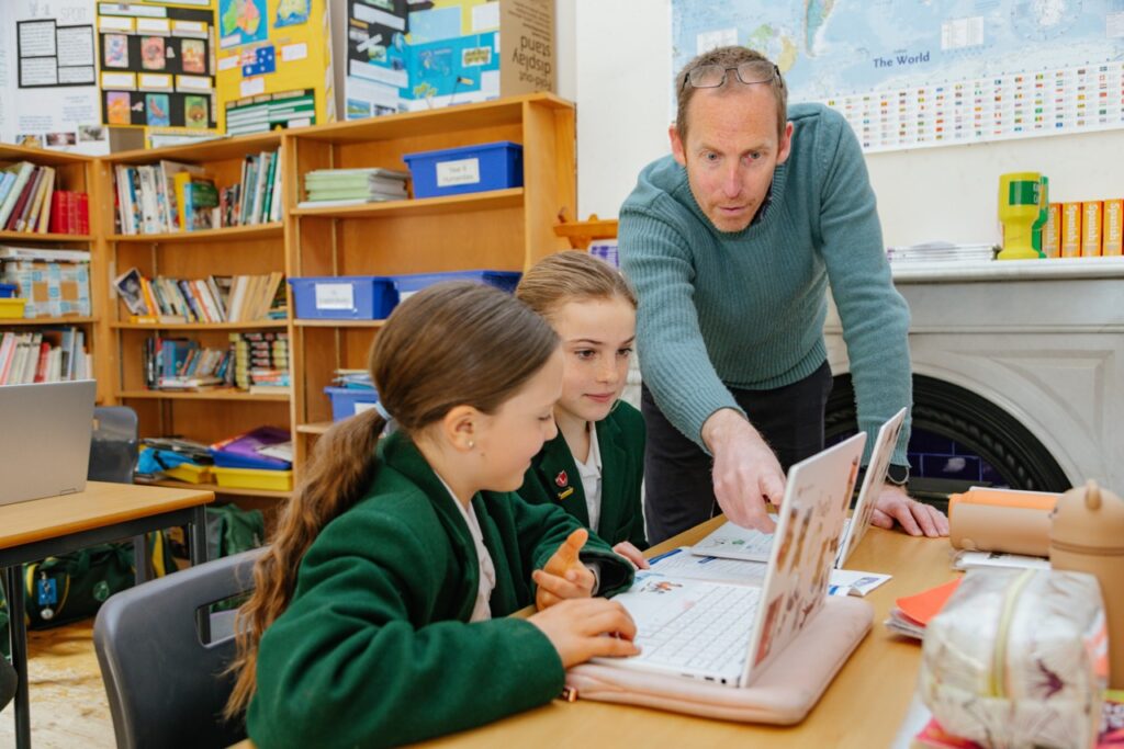 Students learning from a teacher at St Peter’s Prep