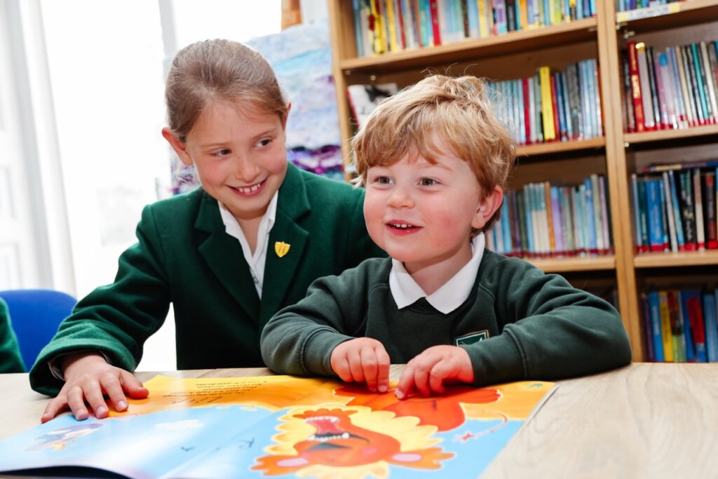 Pupils reading a picture book at St Peter’s Prep