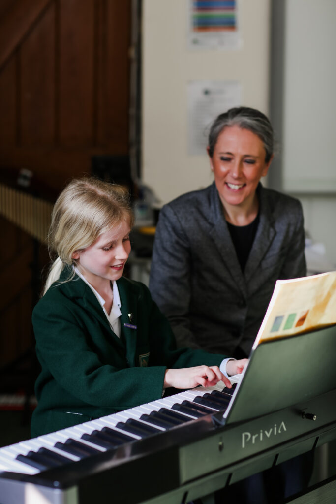 A pupil at St Peter's Prep learning the piano