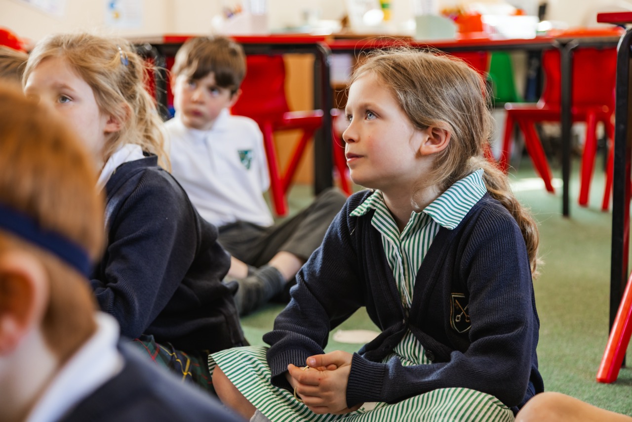 Pupils sitting listening to a teacher at St Peter’s Prep