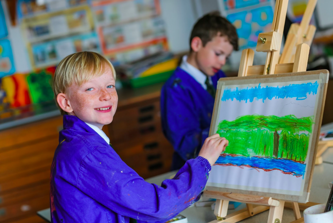 A pupil drawing in an art class