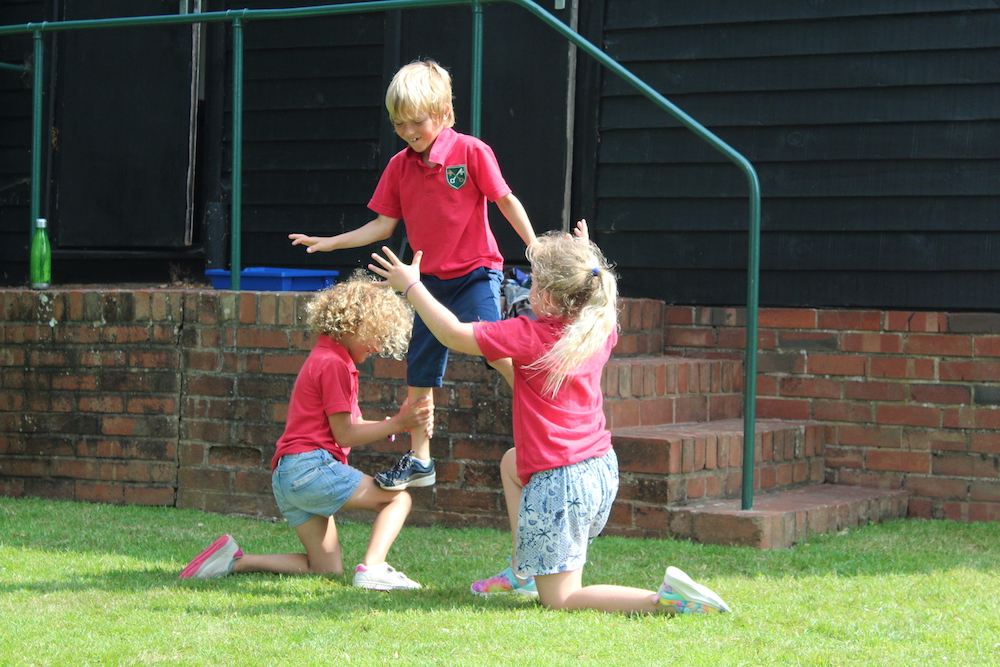 three children playing outside