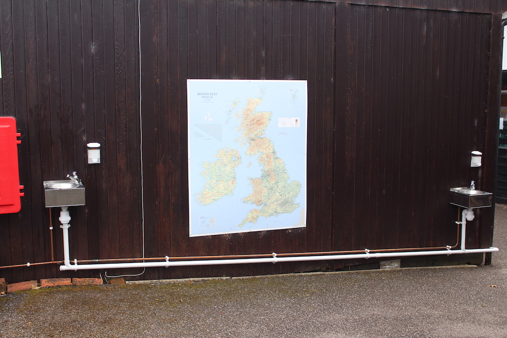 A map of the UK on an outdoor wall