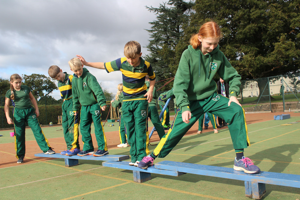 children doing an obstacle course