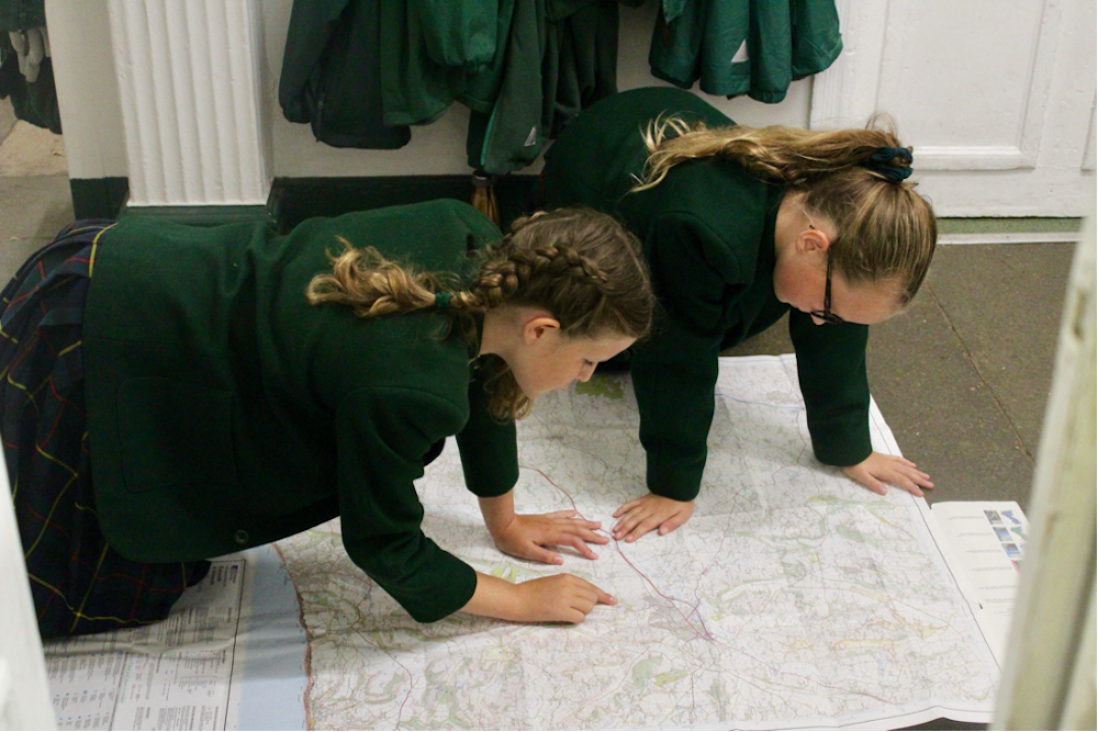 Two girls map reading