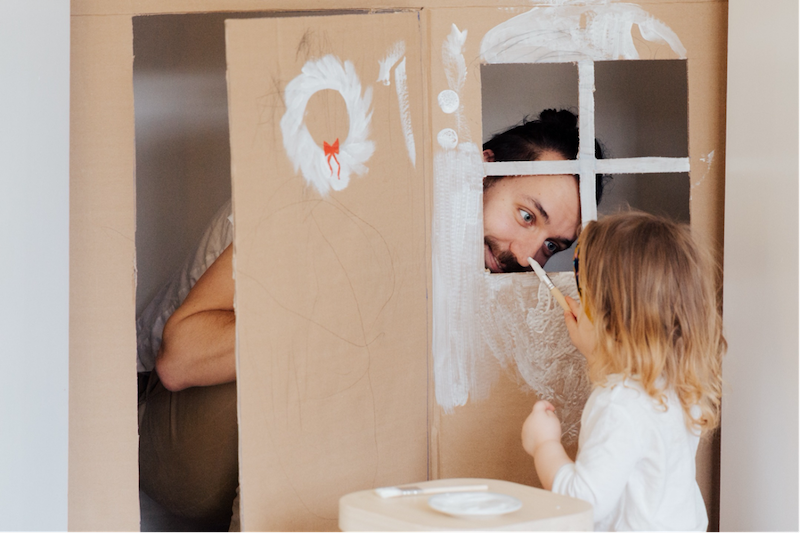 A daughter painting with her father