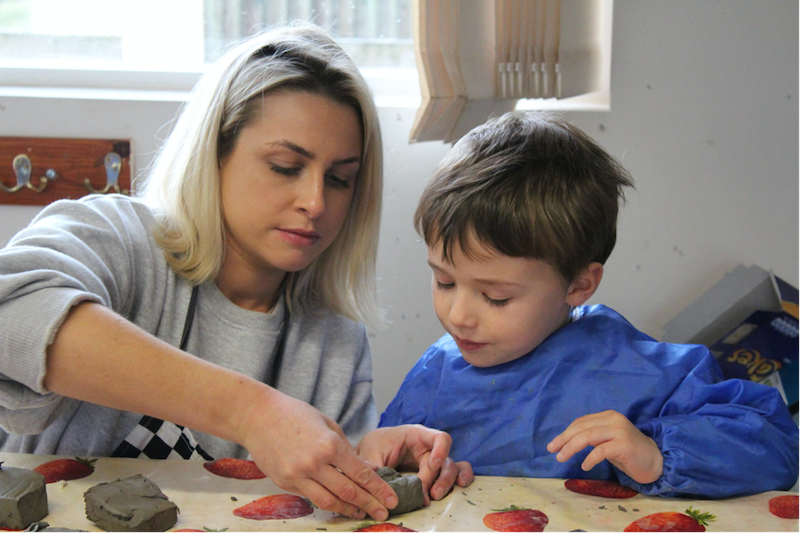 A St Peter's Prep teacher helping a student
