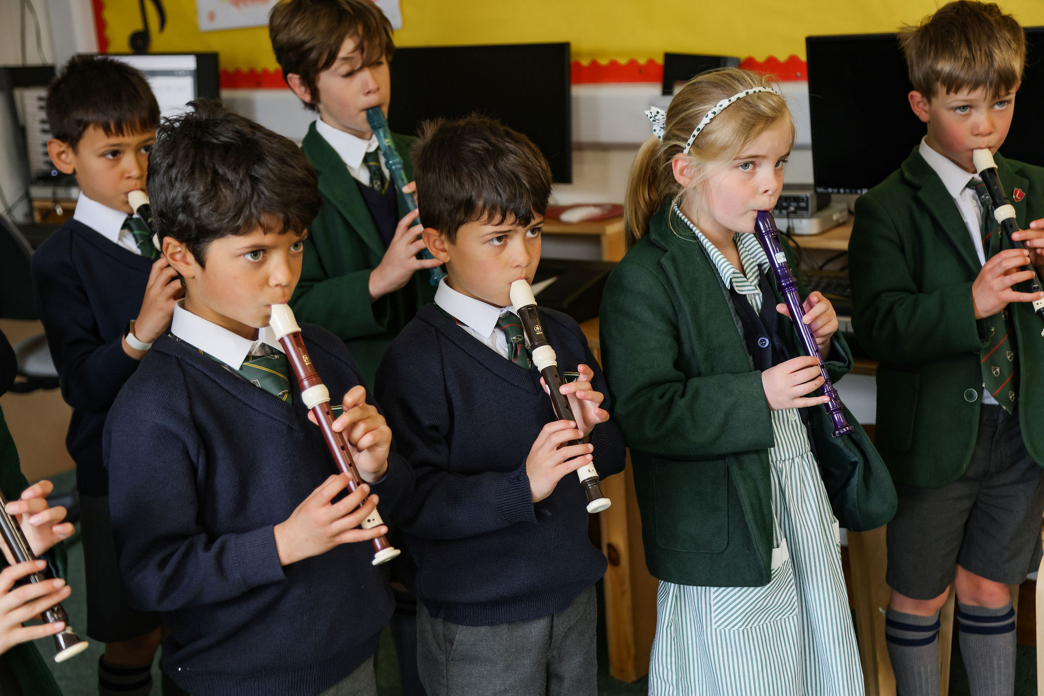 Students playing the recorder