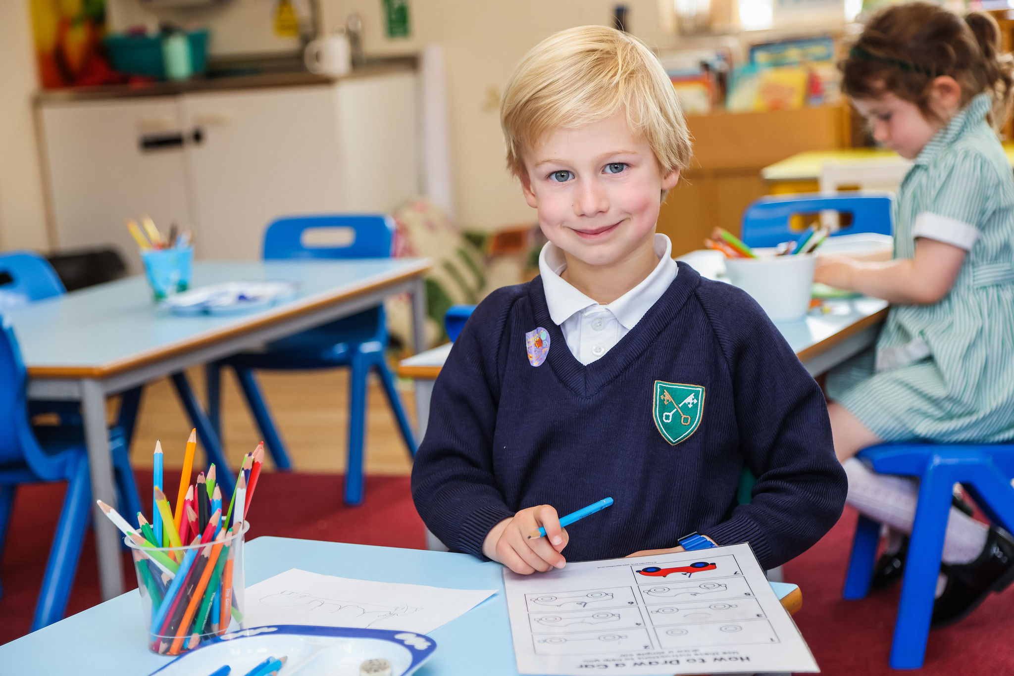 A young St Peter’s Prep pupil filling in a worksheet