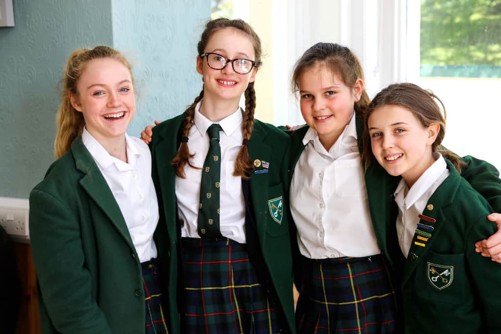 A group of children posing for a photo with their friends