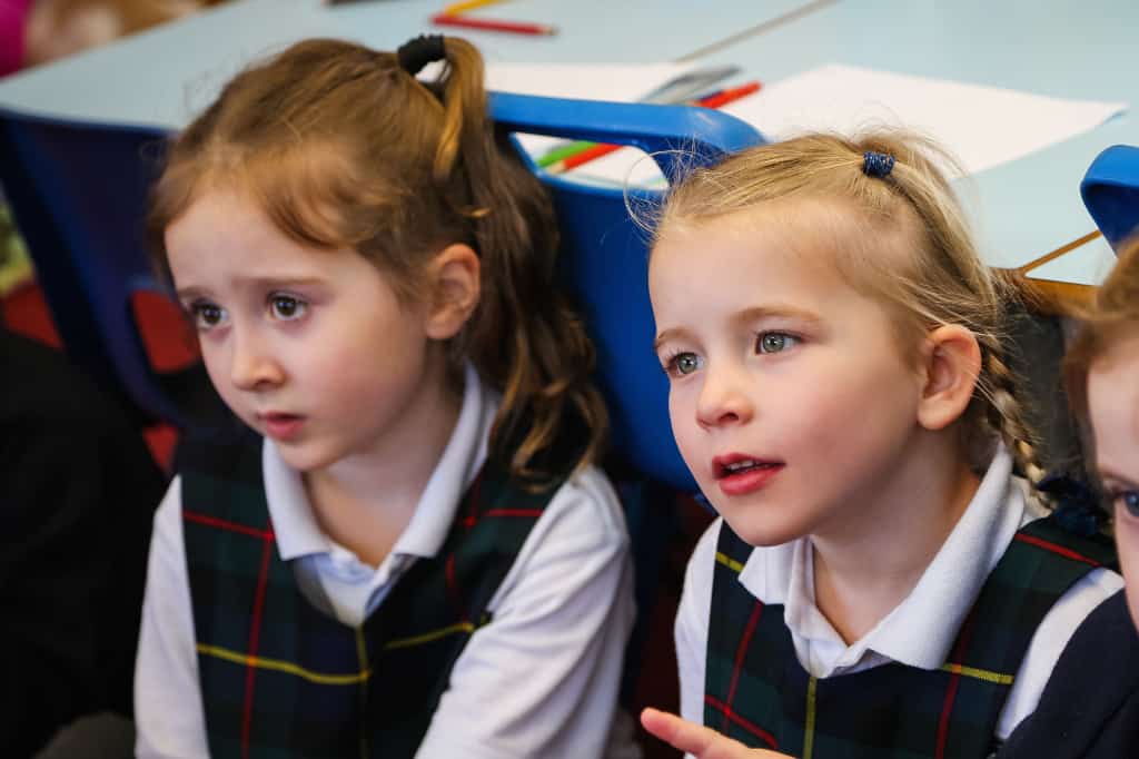 two girls sat in a classroom