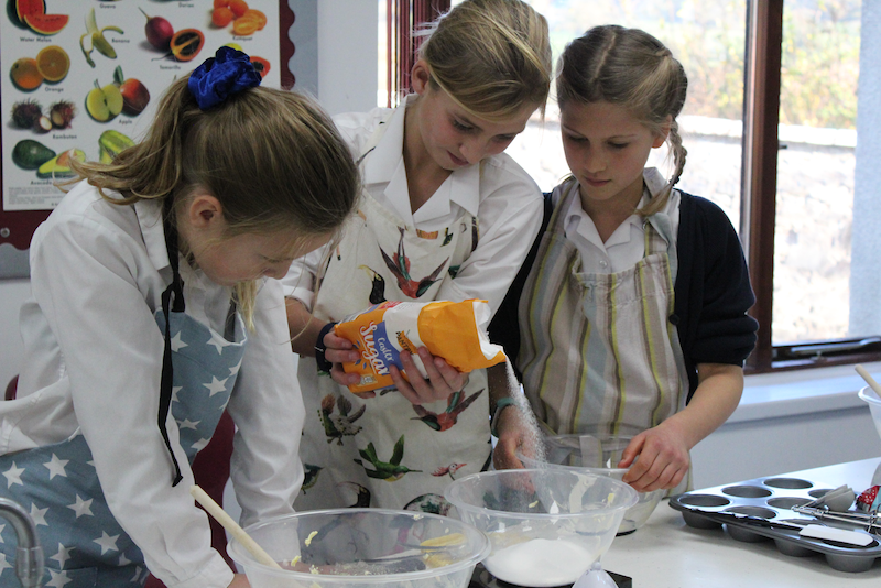 Three girls baking together