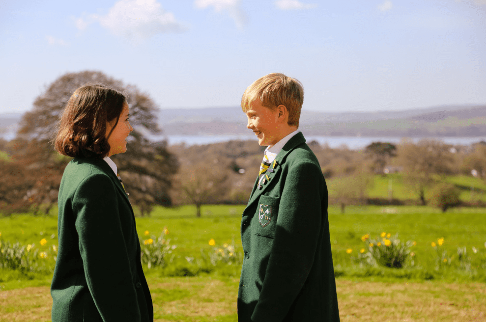 two children smiling in the sunshine