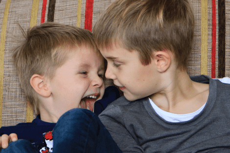 Two young brothers looking at each other