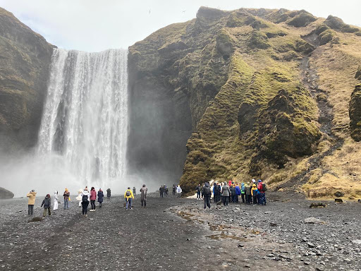 Children Looking At A Waterfall