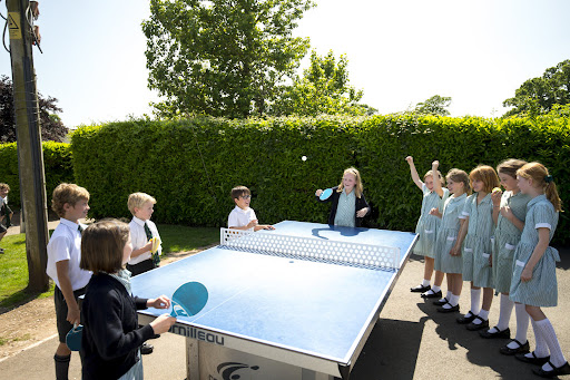 Students playing table tennis