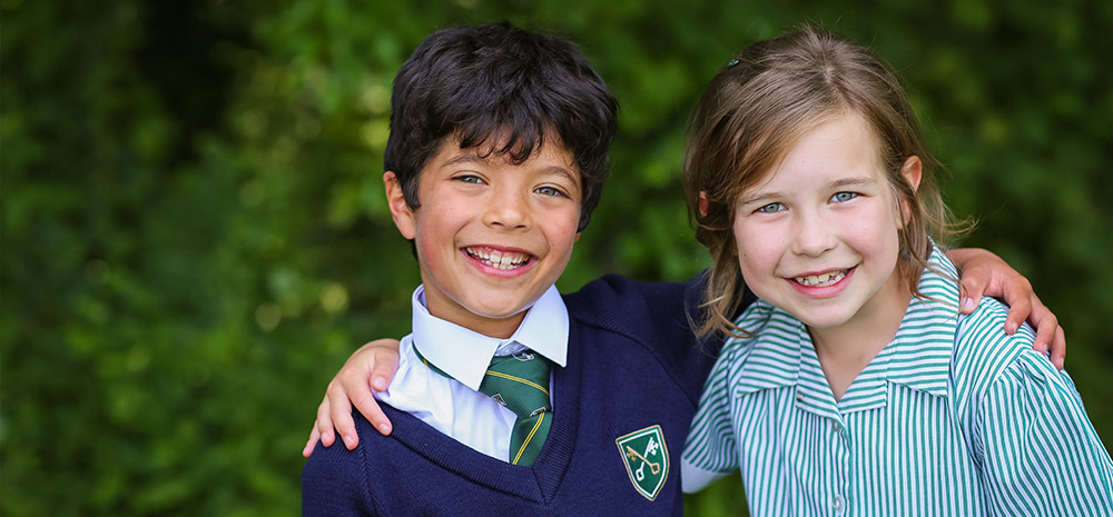 Two smiling students posed for the camera