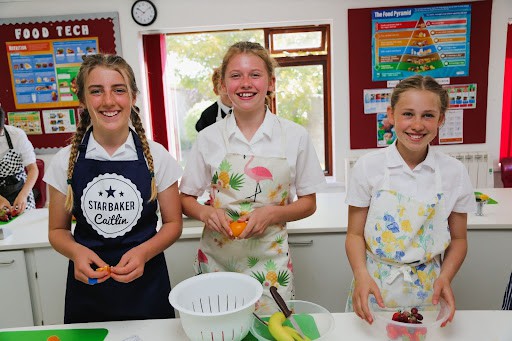 Three St Peter's students in cookery class