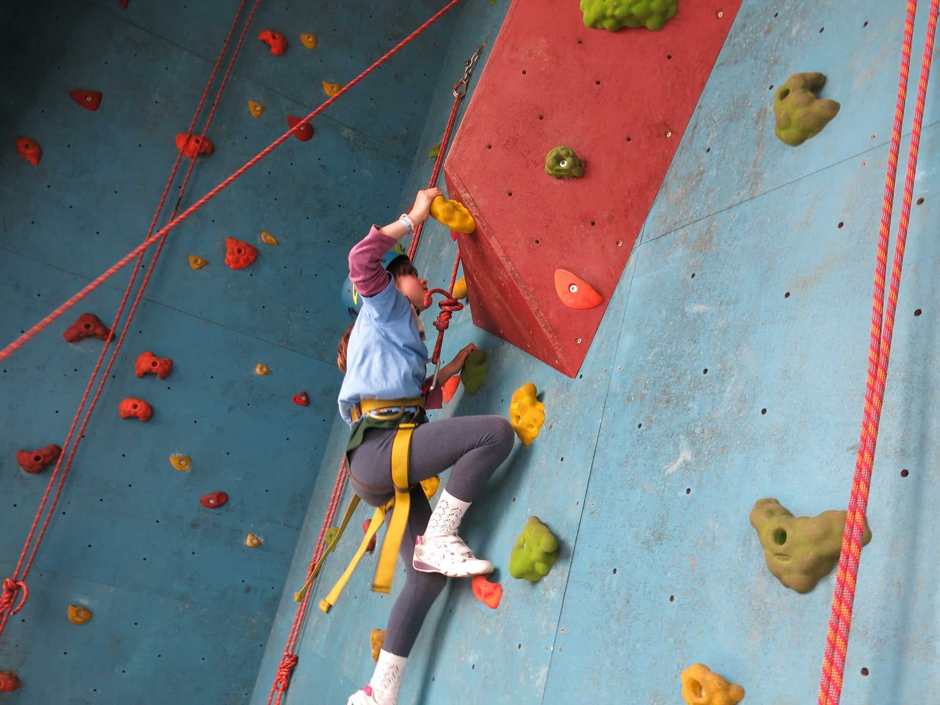 A child on a climbing wall near our Prep School Devon