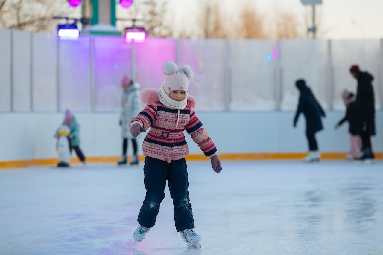 A young girl ice skating
