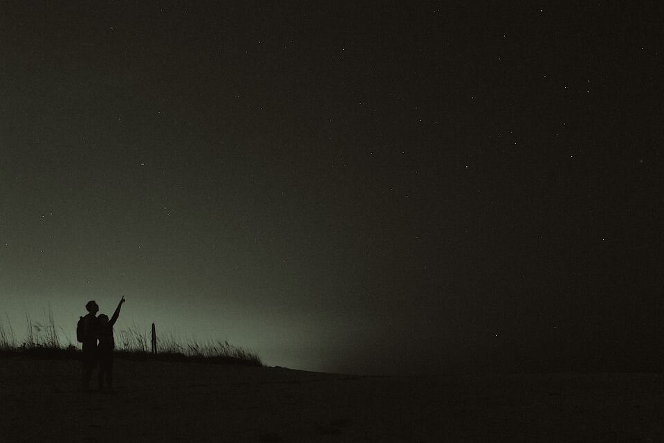 Two people stargazing.