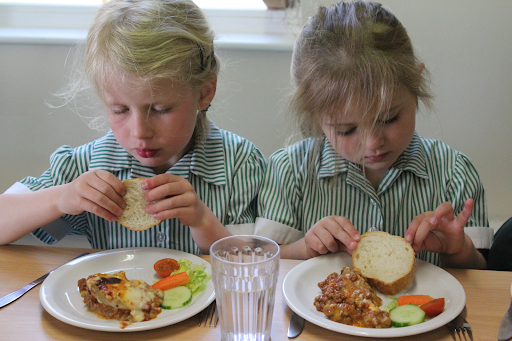 Two girls eating their lunch