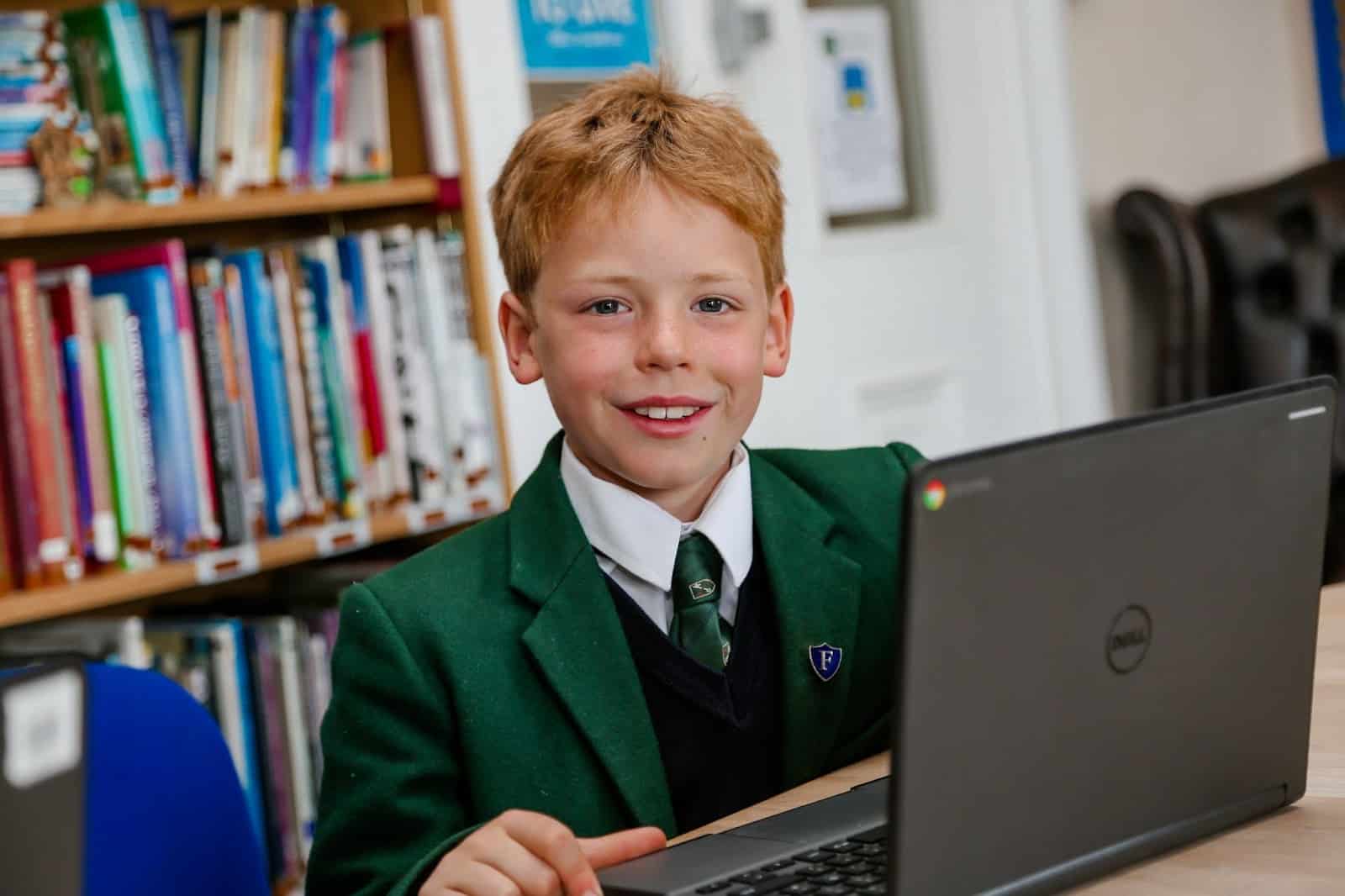 Child working on a laptop