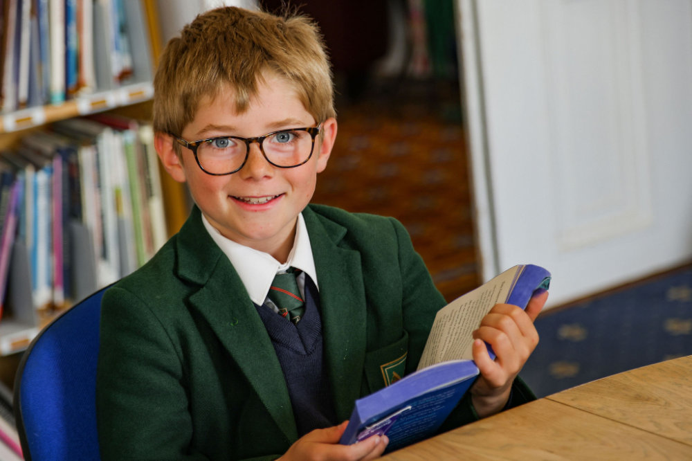 A St Peter’s Prep student reading a book
