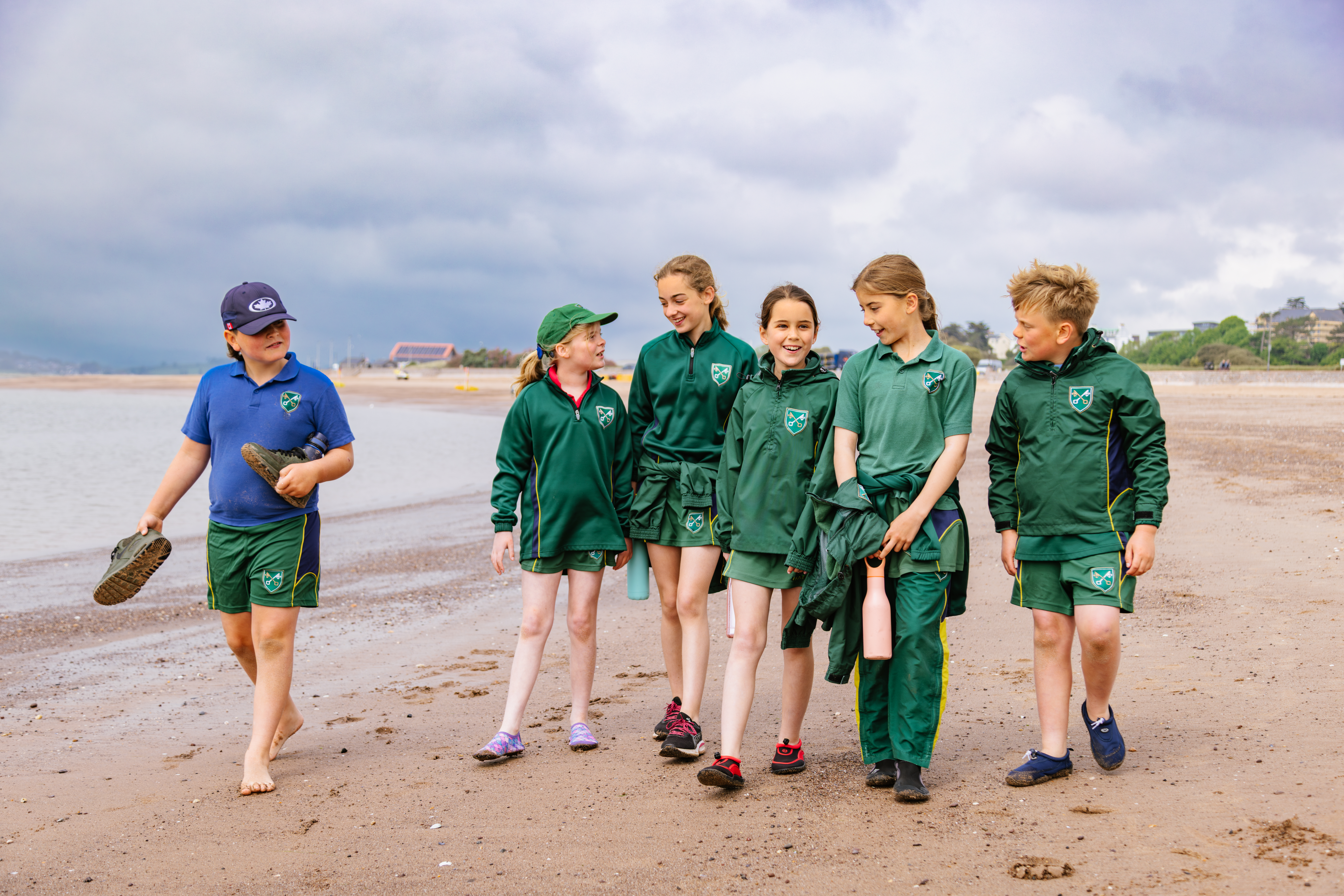 Students enjoying a walk on the beach.